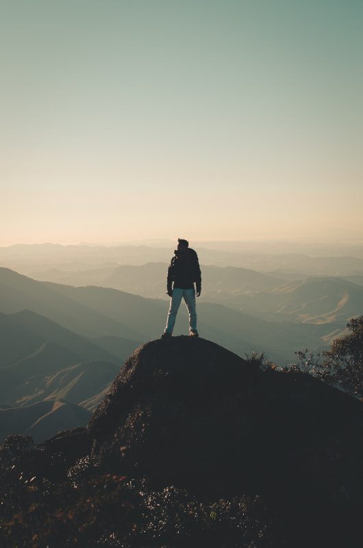 person on top of mountain